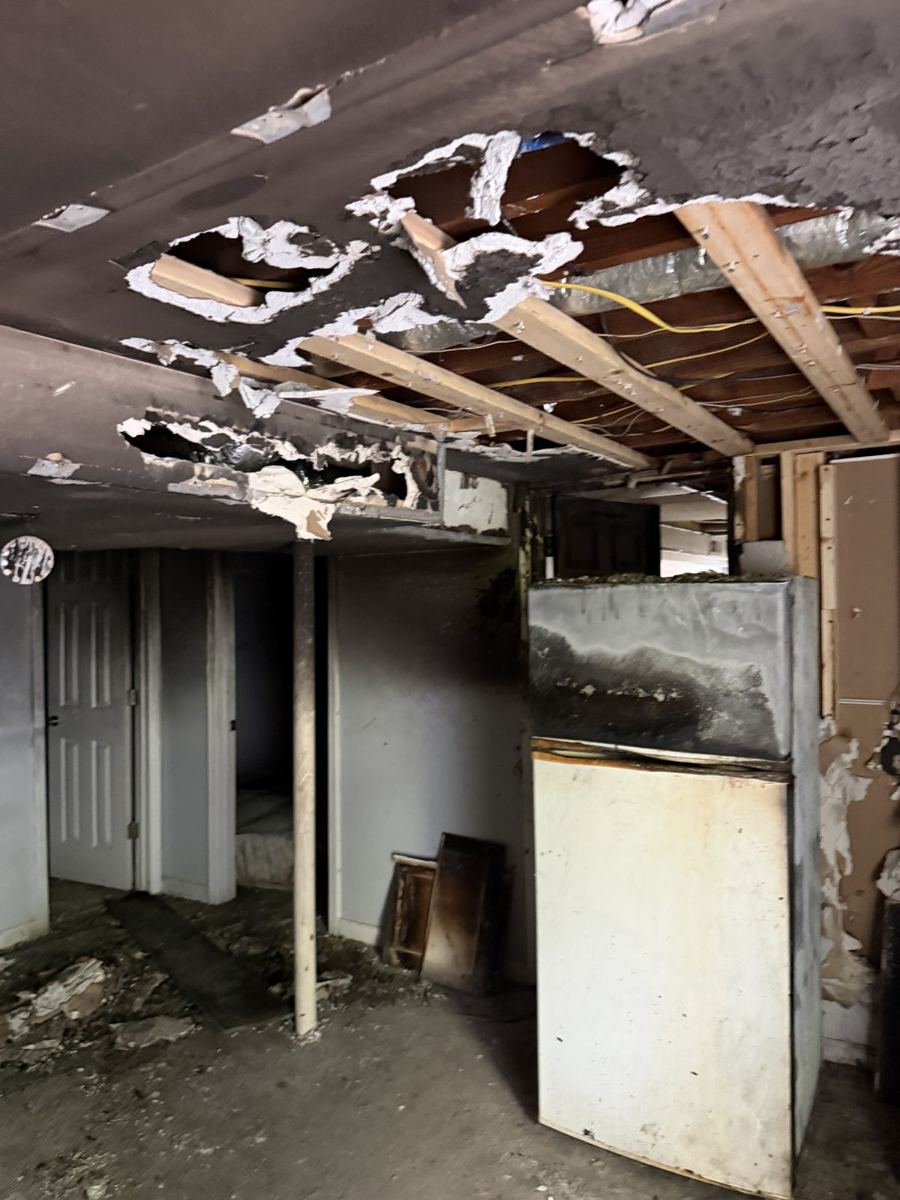 Damaged ceiling and room before demolition