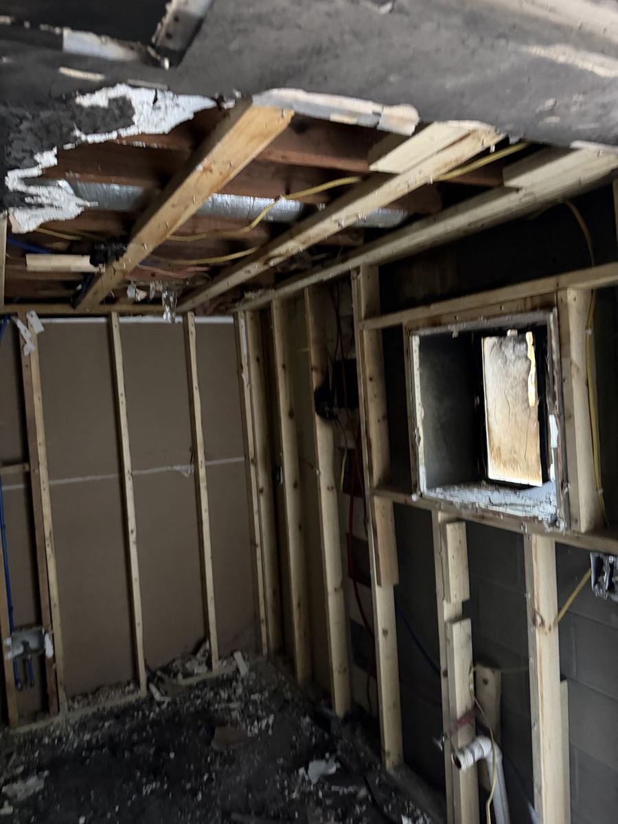 Walls opened to the studs during demolition