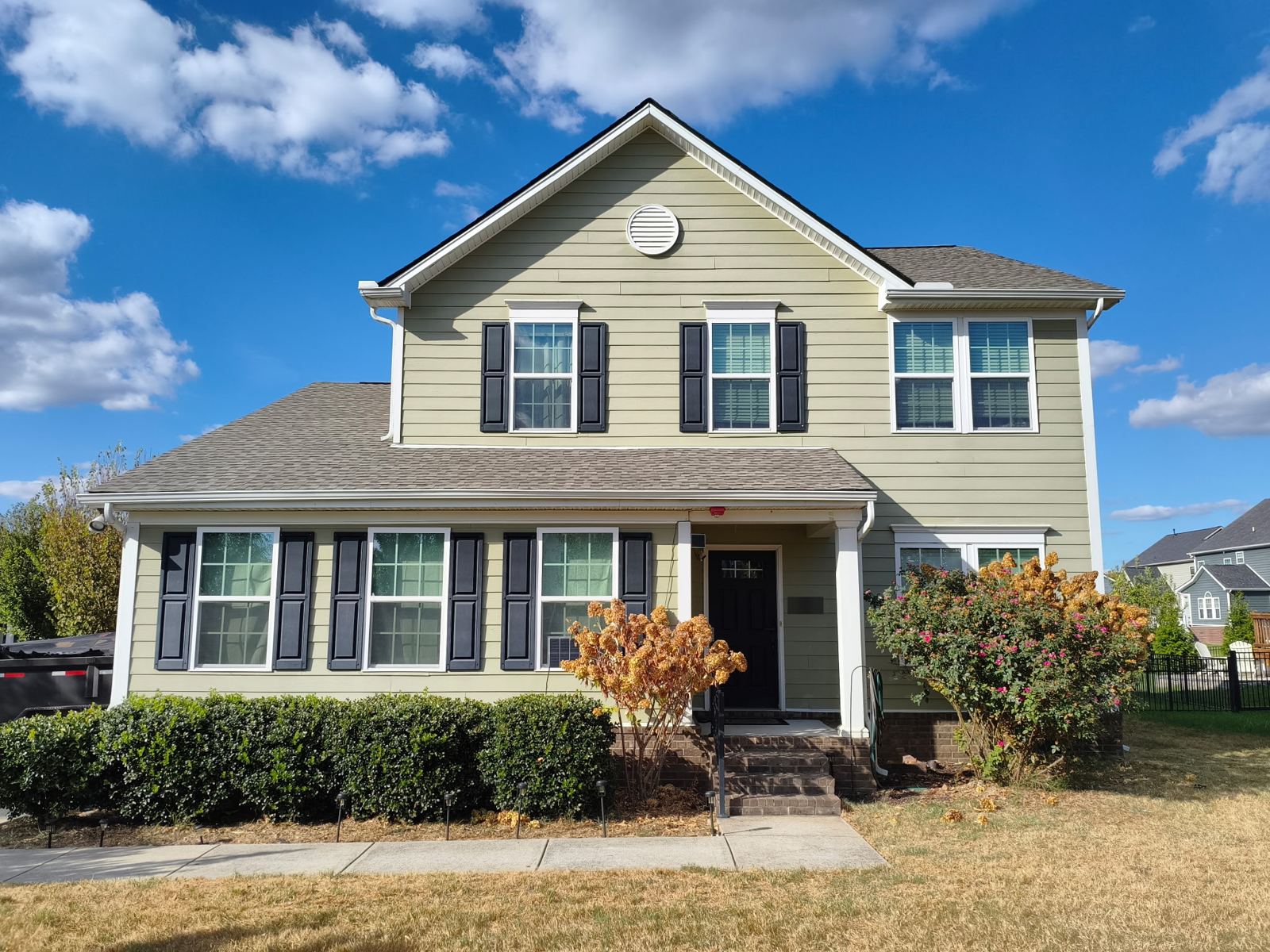 Front of home, roof replacement — after